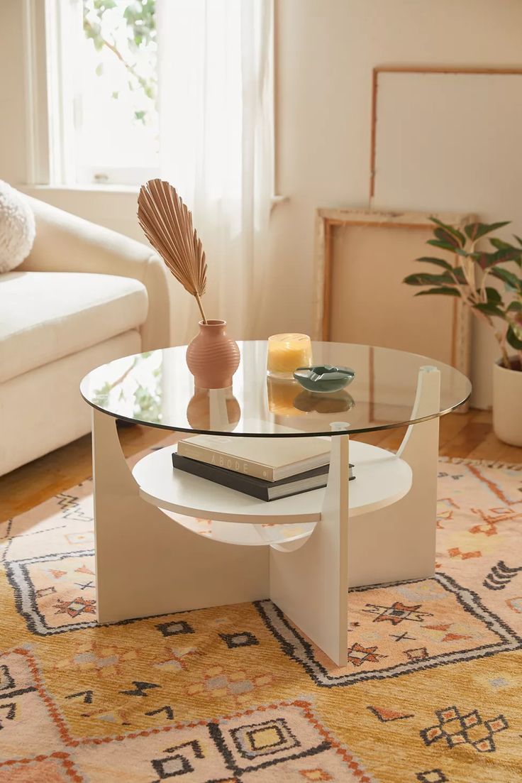 a living room with a couch, coffee table and rug