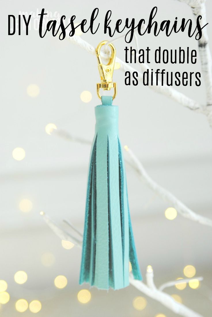 a tassel keychain hanging from a tree with the words diy tassel keychains that double as diffusers