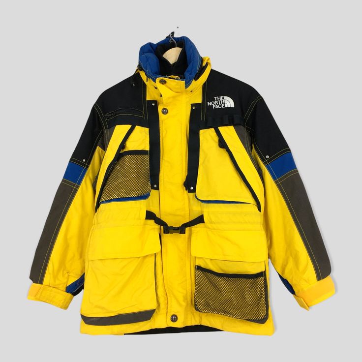 Vintage The North Face Skiwear Jacket Small Vintage 90's North Face Ski Wear Yellow Jacket North Face Tnf Hoodie Skiing Parka Bomber Size S by slayvin on Etsy Winter Sports Nylon Parka With Pockets, Nylon Parka With Pockets For Winter Sports, Hooded Skiing Outerwear With Pockets, Sporty Outerwear With Adjustable Hood For Ski Season, Retro Hooded Windbreaker For Outdoor Activities, Vintage Yellow Windbreaker For Winter, Ski Outerwear With Detachable Hood, Retro Hooded Jacket For Streetwear, Retro Nylon Outerwear For Outdoor Activities