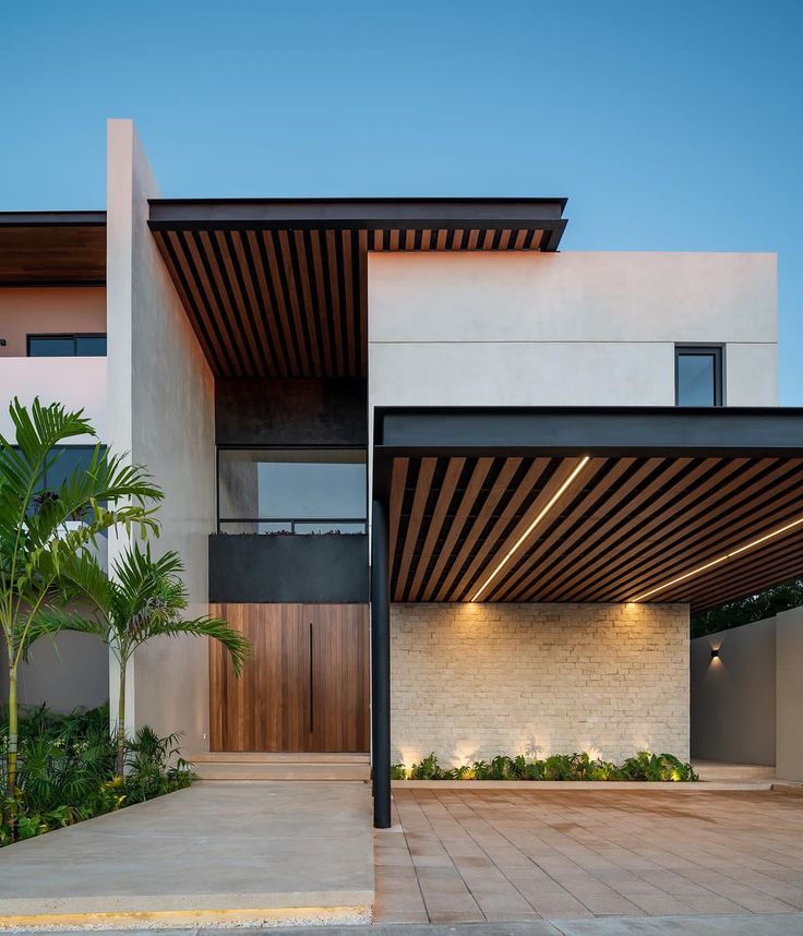 a modern house with an open patio and wooden slatted roof