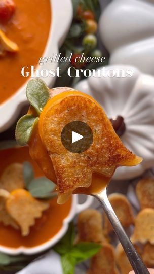 a person holding a spoon with some food on it and the words grilled cheese ghost crosts