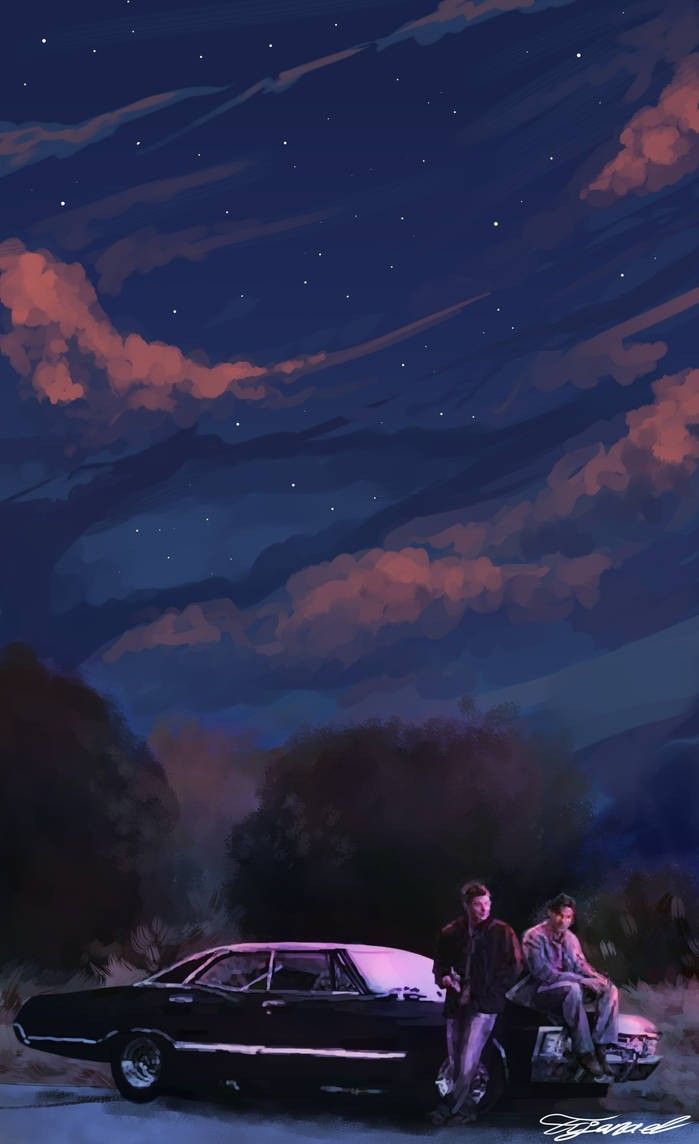 two people sitting on the back of a car in front of a night sky with clouds