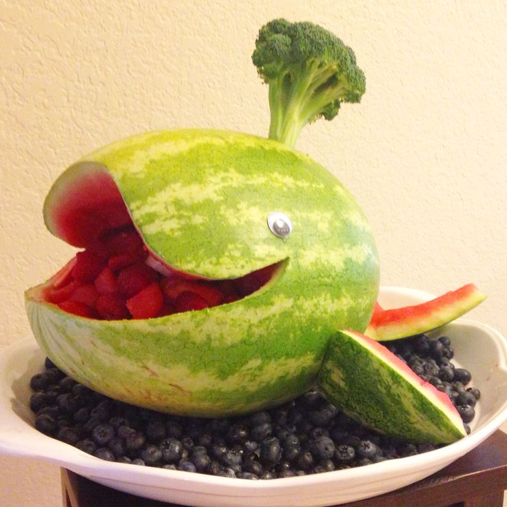 a watermelon shaped like a fish with its mouth open