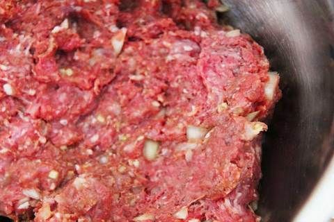 raw ground meat in a metal bowl