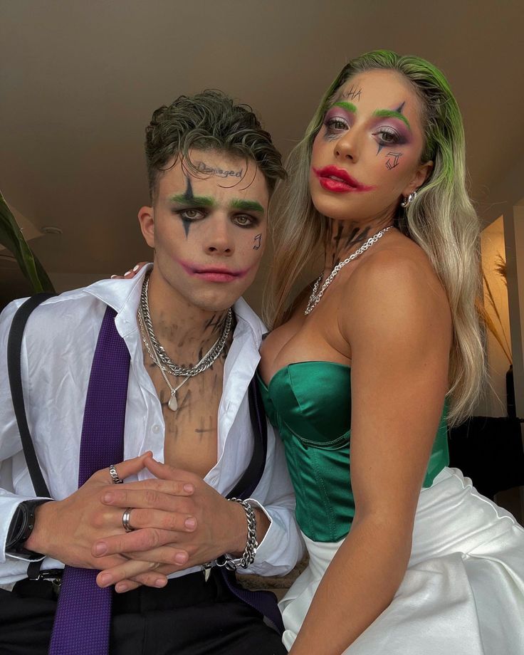 a man and woman dressed up in costume posing for a photo with makeup on their faces