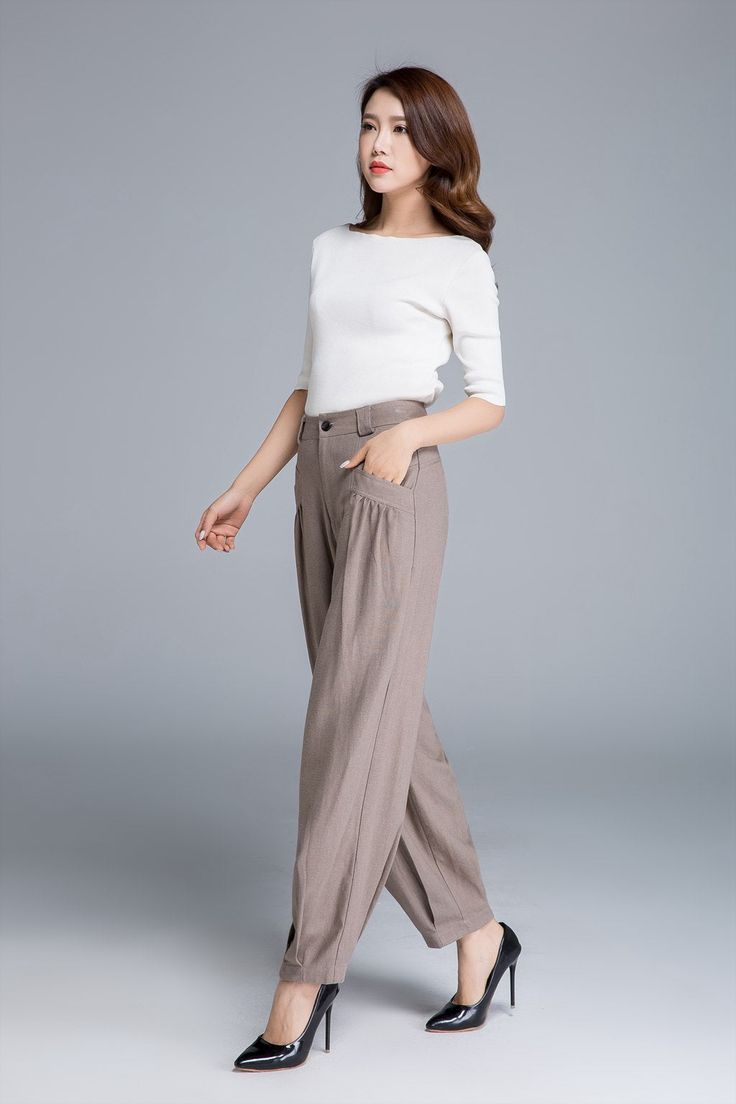 Summer Straight Pants With Button Cuffs, Spring Wide Leg Pants With Button Cuffs, Beige Linen Wide Leg Pants For Fall, Casual Straight Pants With Button Cuffs, Straight Linen Pants With Buttons, Beige Harem Pants For Work, High-waisted Linen Cargo Pants, Beige Harem Pants With Pockets For Work, Beige Loosely Fitted Harem Pants For Work