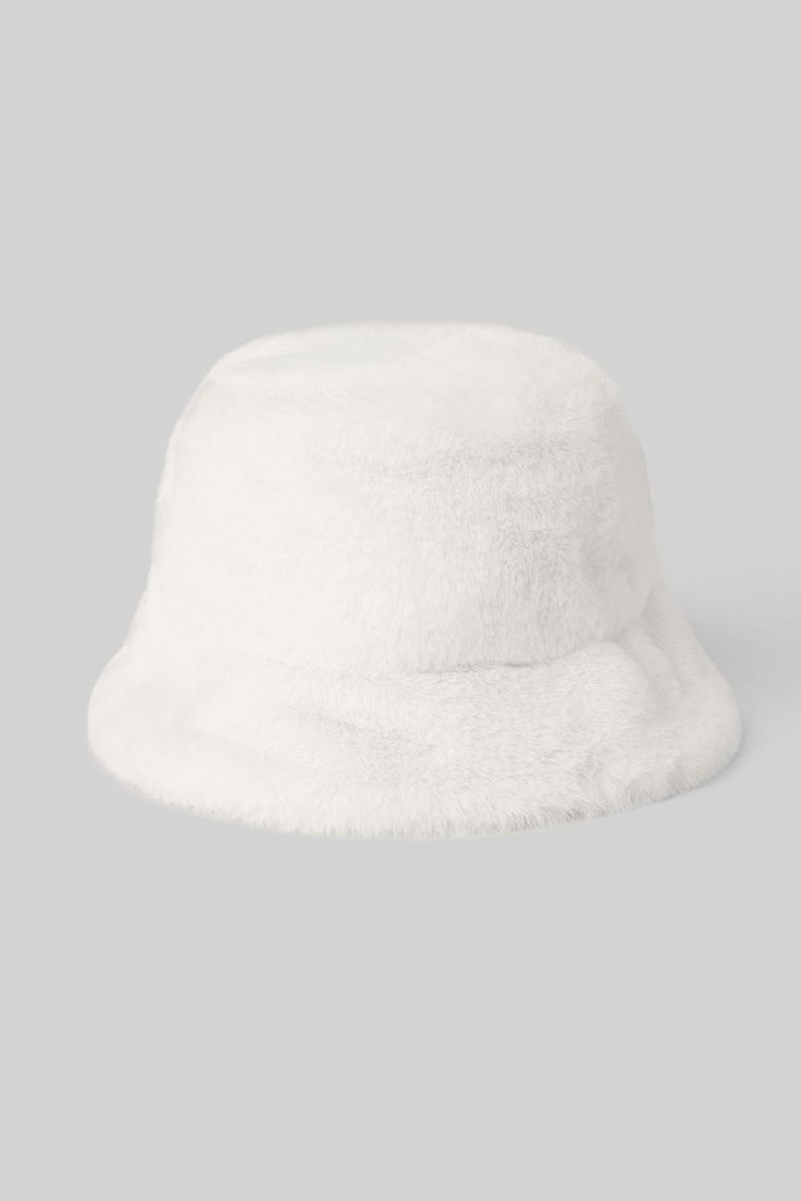 Lightweight. Super-soft. Street-ready. The Faux Fur Bucket Hat is the perfect choice for warming winter headwear in an on-trend bucket hat silhouette. Trendy White Winter Bucket Hat, White Winter Hat With Faux Fur Lining, White Hat With Faux Fur Lining For Winter, Trendy White Warm Hats, Trendy Warm White Hat, Trendy Winter Bucket Hat With Flat Brim, White Soft Winter Hat, Trendy White Winter Hat, White Brimmed Bucket Hat For Winter