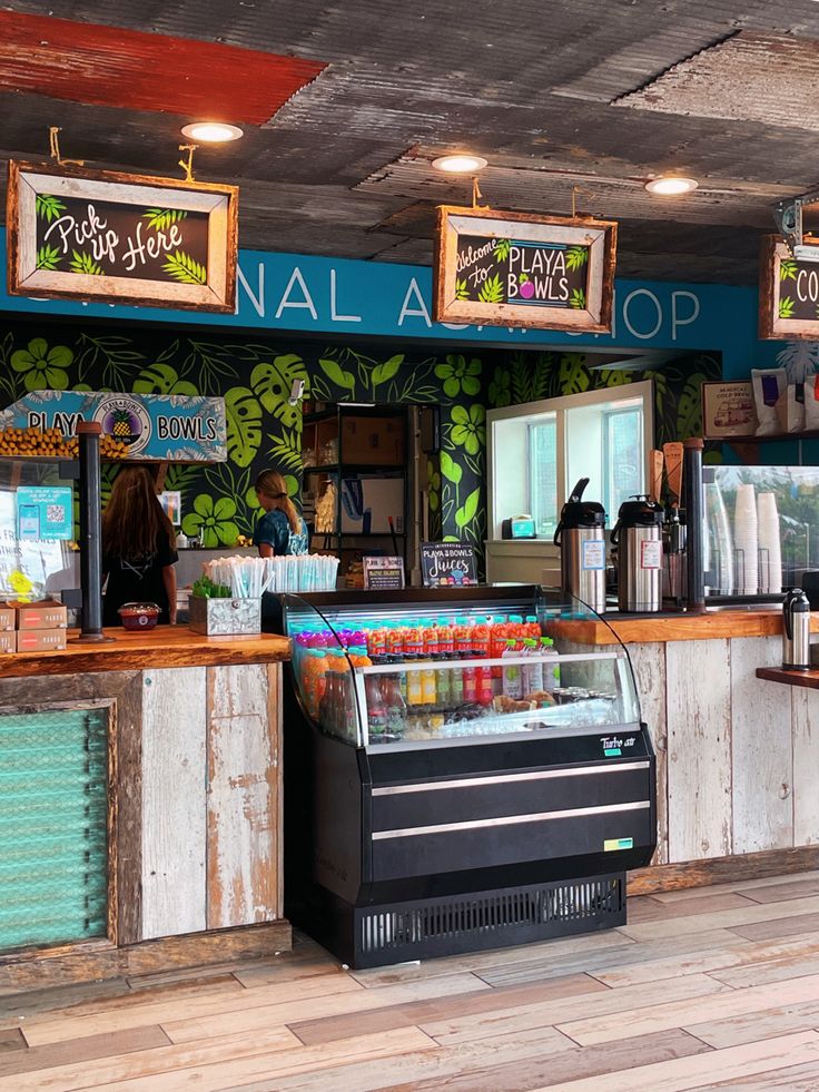 the inside of a restaurant with food on display