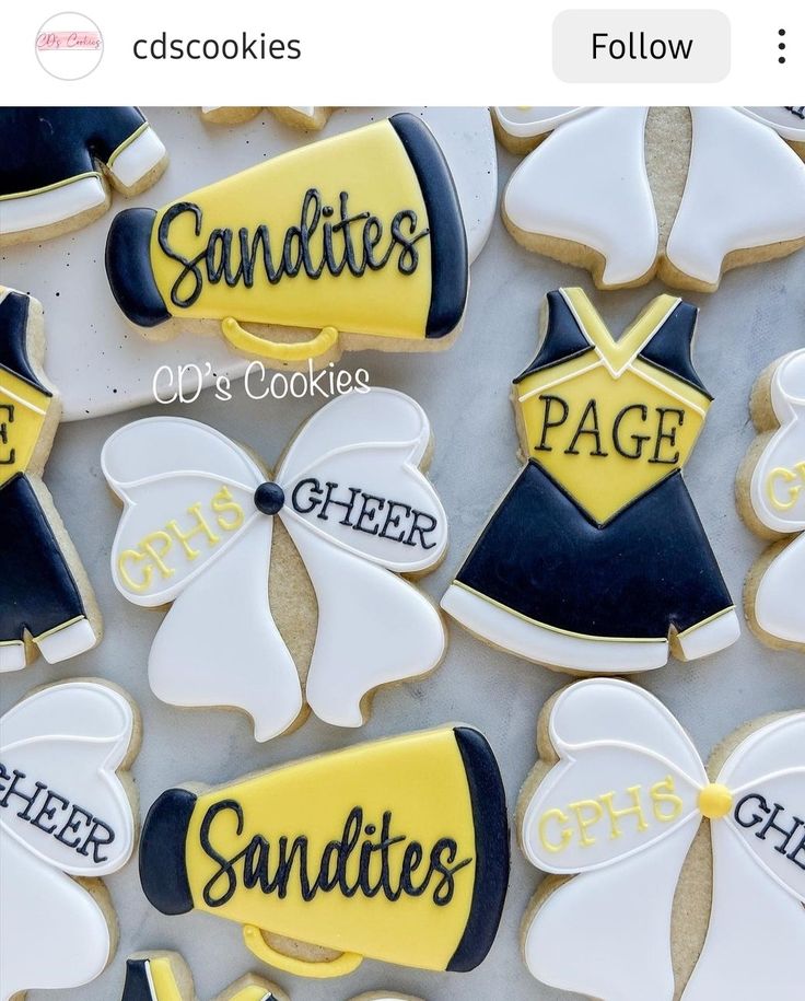 cookies decorated to look like cheerleaders are on display