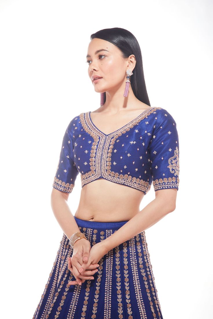 Blue silk lehenga with intricate motifs at the base and delicate lines of zardozi paired with matching blouse and net dupatta with thick main border and thinner borders on 3 sidesFrom Chamee and Palak 's The Wedding Edit collectionDELIVERY TIMEPlease allow 8-12 weeks for your outfit to arrive.FABRIC DETAILSSilk And NetProfessional cleaning only. Blue Raw Silk Sets With Cutdana, Blue Raw Silk Sets With Cutdana Details, Blue Chanderi Pre-draped Saree With Intricate Embroidery, Blue Dola Silk Pre-draped Saree For Reception, Elegant Blue Pre-draped Saree With Dori Work, Elegant Blue Cutdana Sets, Fitted Blue Pre-draped Saree With Intricate Embroidery, Fitted Blue Tissue Silk Blouse Piece, Blue Chanderi Sets For Reception