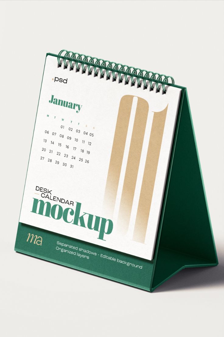 a green desk calendar sitting on top of a table