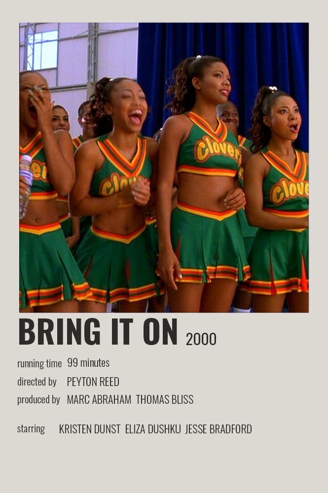 a group of cheerleaders singing in front of a crowd