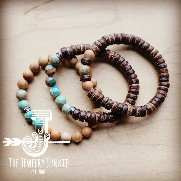 This set of three stretch bracelets combines Imperial Jasper beads and wood beads for a stunning combination of earthy tones and textures. Stylish and versatile, this trio of bracelets is the perfect accessory for modern boho looks and western-inspired ensembles. 8-10mm beaded stretch bracelet Made of Wood and Genuine Imperial Jasper Beads Stretch bracelet fits a variet of wrist sizes Although your item will resemble the photo, each piece is created by hand, so no two are identical.Thank you for Rustic Brown Bracelets With Natural Stones, Bohemian Stretch Bracelet For Everyday, Rustic Wooden Beads Bracelet, Bohemian Stretch Bracelet With 8mm Beads For Everyday, Brown Stretch Bracelet With Stackable Round Beads, Spiritual Brown Stackable Beaded Bracelets, Rustic Beaded Bracelets With Natural Stones, Adjustable Rustic Beaded Bracelets For Everyday, Rustic Adjustable Beaded Bracelets For Everyday