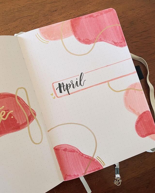 an open notebook with the word april written on it