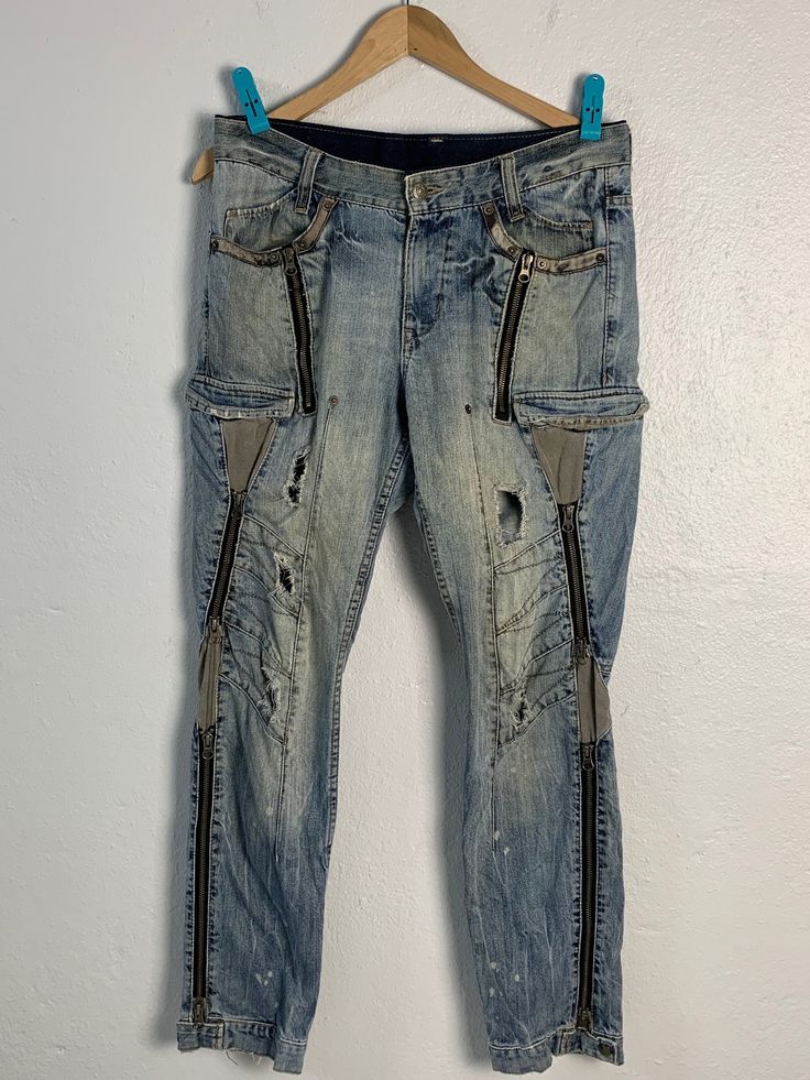 CONDITION - Pre-owned. - Used condition (scale 8.5/10) - No stain but have hole/rip (style) at in-front and 1 belt holder missing at waist - Refer picture TAG AND MATERIALS - Label : PPFM - Size on tag : M (from measurement it fit to size 33) - Made : China MEASUREMENT - Waist : 16.5 inches  - Inseam : 30 inches - Leg Opening : 6.5 inches - Front Rise : 12 inches - Thigh : 12 inches - Knee : 7.5 inches PLEASE LEAVE YOUR PHONE NUMBER ON THE NOTE WHILE MAKE A PURCHASE AND PLEASE MAKE SURE YOUR ADD Distressed Denim Cargo Jeans In Grunge Style, Grunge Distressed Denim Cargo Jeans, Streetwear Distressed Acid Wash Cargo Jeans, Distressed Acid Wash Cargo Jeans For Streetwear, Edgy Distressed Denim Cargo Jeans, Grunge Jeans For Alternative Fashion, Alternative Style Jeans With Belt Loops For Streetwear, Distressed Denim Blue Grunge Cargo Jeans, Distressed Denim Blue Cargo Jeans In Grunge Style