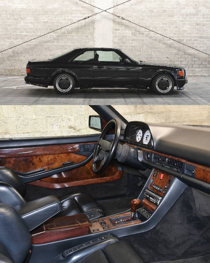 the interior and dashboard of a black car with wood trims, including steering wheel