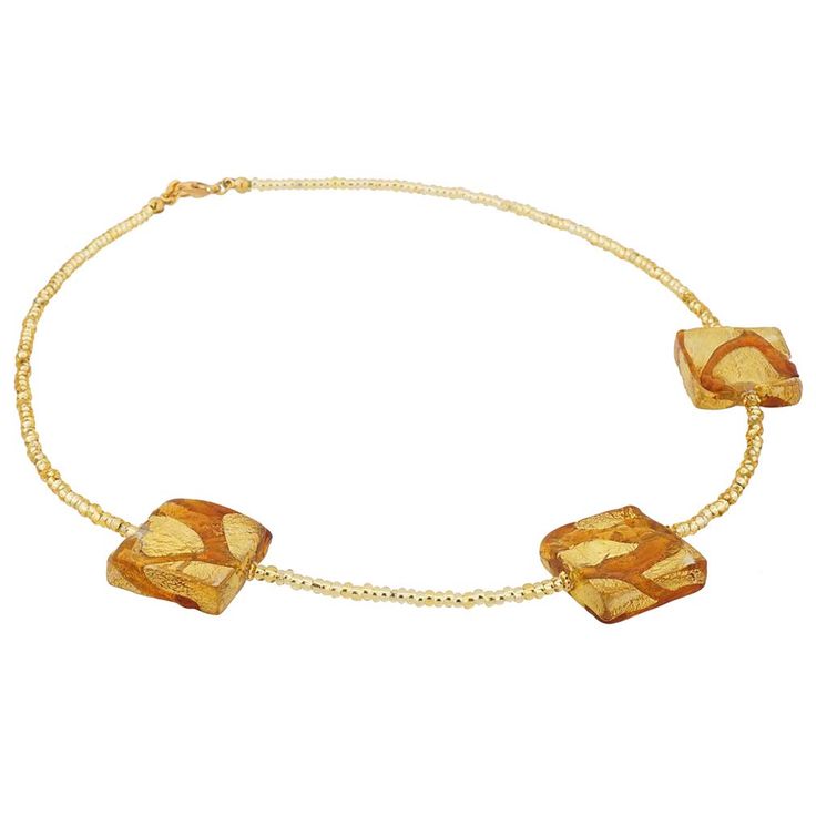 Artistic and unique, exquisite and classic, this beautiful Venetian necklace showcases the richness and magic of Murano Glass Art. The unique design born in the fire of Venetian Glass furnaces features handcrafted Murano beads where waves of richly colored glass flow above 24K gold leaf and create sparkly reflections when they capture the light. What's more, even the tiny seed beads that make up this necklace are entirely handcrafted by Venetian glassmakers using 24K gold leaf, setting this neck Elegant Amber Beaded Necklace, Single Strand Glass Spiritual Necklace, Single Strand Spiritual Glass Necklace, Spiritual Single Strand Glass Necklace, Elegant Amber Crystal Necklace With Round Beads, Elegant Amber Crystal Necklaces With Round Beads, Elegant Amber Crystal Necklaces With Polished Beads, Elegant Amber Single Strand Beaded Necklace, Elegant Amber Beaded Necklace Single Strand