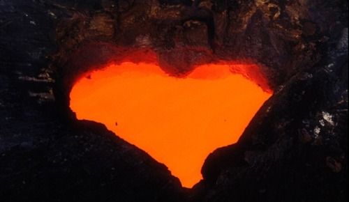 an orange heart shaped hole in the ground