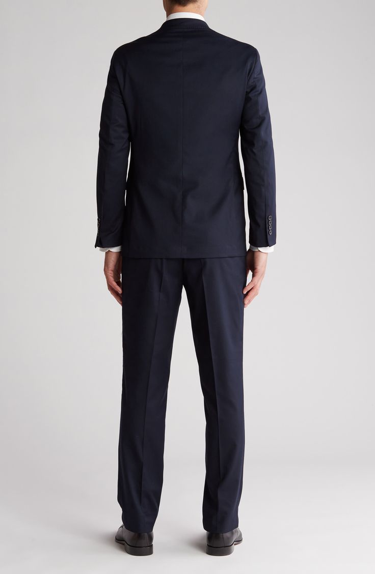 Whether it's an office occasion or a special event, this dapper suit crafted from performance stretch fabric can do it all. 31" length; 32" inseam; 15 1/2" leg opening; 10" front rise pants Jacket has notched lapels; four-button cuffs; chest welt pocket; flap pockets; interior pockets; side vents Trousers have zip fly with button closure; front slant pockets; back button-welt pockets Jacket is lined; trousers are lined to the knee 80% polyester, 18% rayon, 2% spandex Dry clean Imported Professional Slim Fit Workwear Sets, Slim Fit Pantsuit With Notch Lapel For Office, Tailored Professional Pantsuit For Semi-formal Occasions, Professional Slim Fit Business Casual Sets, Professional Slim Fit Sets For Business Casual, Fitted Professional Business Sets, Professional Fitted Business Sets, Custom Fit Notch Lapel Sets For Business Casual, Fitted Professional Three-piece Suit For Semi-formal Occasions