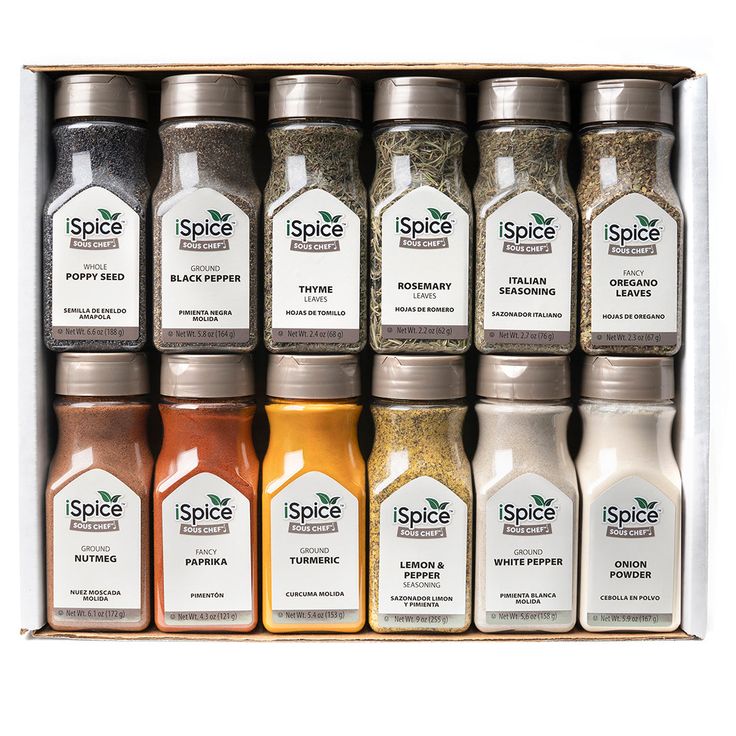 an open spice box filled with lots of different spices and seasonings on top of each other