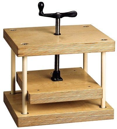 a wooden table with two shelves and a bike handle