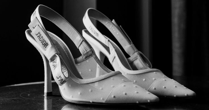 a pair of white shoes sitting on top of a table