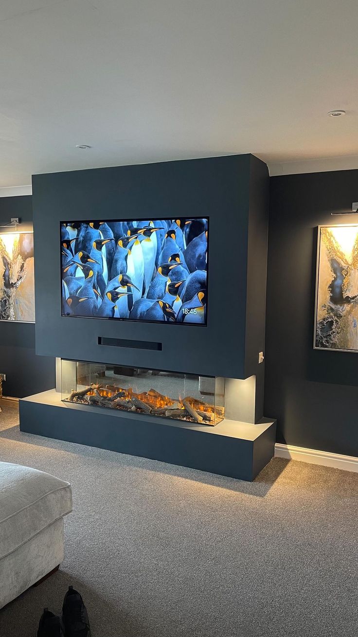 a large flat screen tv mounted to the side of a wall in a living room