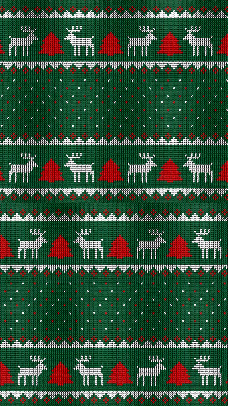 a green and red knitted christmas sweater with reindeers