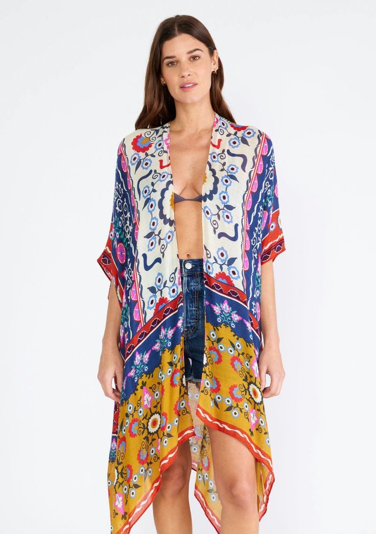 A dreamy lightweight kimono in a natural and mustard mixed floral print. Mixed floral print Relaxed, oversize fit Half-length kimono sleeve Mid-length Side vents Open front Bohemian style Our lightweight boho kimono is a quick and easy cover-up, perfect for the beach or sitting poolside. Designed in a unique mixed floral print, with breezy half-length sleeves, an open front, and a versatile mid-length. The brightly multi-colored print is sure to turn heads. Model is 5'9, garment is O/S.Style: I- Multicolor Summer Sleep Kimono, Tropical Multicolor Kimono Sleeves Cover-up, Affordable Boho, Multicolor Printed Kimono For Beach Cover-up, Multicolor V-neck Kimono With Floral Print, Multicolor Floral Print Cover-up With Kimono Sleeves, Floral Print Kimono, Print Kimonos, Boho Kimono