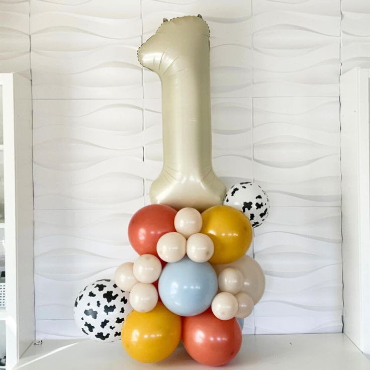 a balloon column with a number one on it