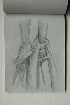 a pencil drawing of two hands holding each other's arm, with the background rolled up