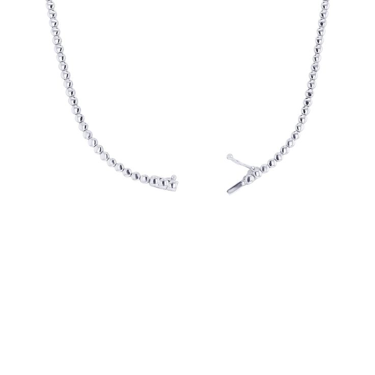 Elevate any look with the 17 inch Raddix Diamond Drop Necklace. Crafted with 4 5/8 carats of diamonds set in 18 karat gold, this necklace makes a statement of sophistication and timeless elegance. A delicate design adds a touch of refinement to your wardrobe. Elegant Sterling Silver Tennis Necklace With Single Cut Diamonds, Timeless Single Strand Diamond White Jewelry, Elegant White Gold Chain Necklace For Everyday Luxury, Elegant White Gold Chain Necklace, Elegant Single Strand Chain Necklace For Formal Occasions, Elegant Everyday White Gold Chain Necklace, Elegant Everyday Luxury White Gold Chain Necklace, Timeless Diamond Cut Tennis Necklace, Refined Silver Necklace With Single Cut Diamonds