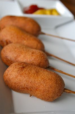 several fried food items are lined up on a white plate