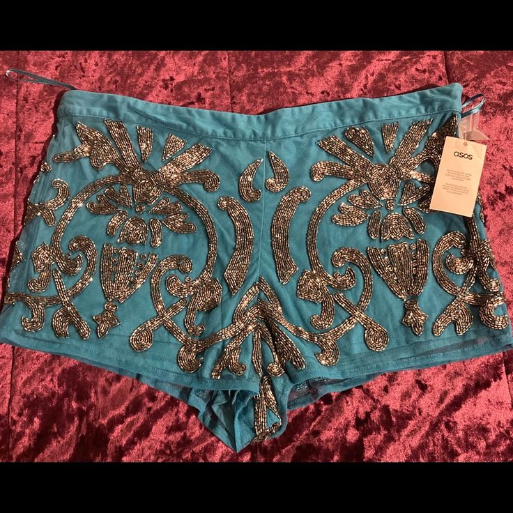 Teal & Silver Beaded Shorts By Asos Bohemian Embellished Bottoms For Festival, Fitted Sequin Bottoms For Summer, Embellished Party Bottoms For Summer, Chic Party Shorts In Blue, Chic Blue Party Shorts, Chic Blue Shorts For Party, Embellished Blue Bottoms For Night Out, Chic Sequined Shorts For Summer, Bohemian Embellished Fitted Bottoms