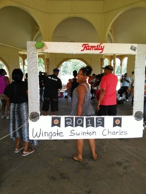 a group of people standing under a tent with a sign that says wingate summit charles