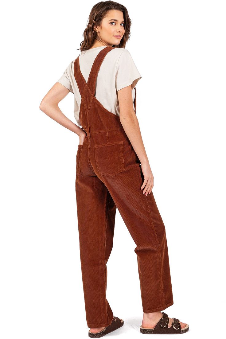 Bib-and-brace overalls with a relaxed, boyfriend fit. Adjustable, thick racerback straps connect to a functional, multi-pocket bib with a Lana Roux logo patch. Oversize silhouette with button closures on both sides. Slim-straight bottoms that taper at the ankle. Lightweight yet durable construction, great work wear option. CARE | Machine Wash Cold Inside Out CONTENTS | 100% Cotton MEASUREMENTS | 60"/152 cm Top to Bottom 30"/76 cm Inseam (Size Small) MODEL | 5'8 - wearing a size Small IMPORTED Bib And Brace Overalls, Corduroy Dungarees, Lucy And Yak, Long Pant Jumpsuit, Dungarees Shorts, Corduroy Overalls, Dungarees, Hat Hairstyles, Playsuit Jumpsuit