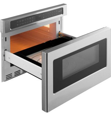 an open microwave oven with the door opened