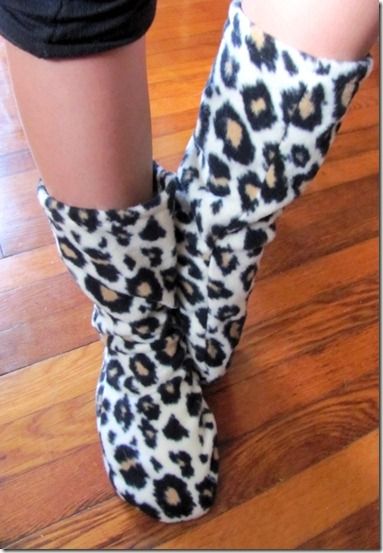 a woman's legs wearing leopard print boots