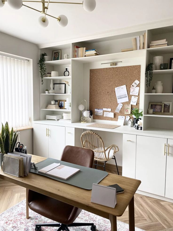 an office with a desk, chair and bookshelf