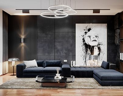 a modern living room with black couches and art work on the wall behind it