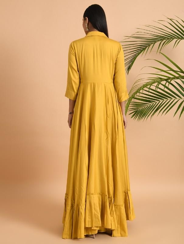 A shawl collared cotton silk maxi dress with flared and flounced bottom, side pockets, and long sleeves Garment measurements (in Inches): Small: Bust - 39", Waist - 29" Medium: Bust - 42", Waist - 32" Large: Bust - 45", Waist - 35" Length: 55-56", Sleeve length: 17" Fabric: Cotton Silk Color: Yellow Fit: Model height is 5'7" Model is wearing a size S Loose and comfortable fit. Instructions: Hand wash separately in cold water Note: Available in other colors Pants not included with the product Pan Festive Ruffled Maxi Dress, Festive Maxi Dress With Ruffles, Anarkali Dresses With Ruffles, Festive Ruffled Long Sleeve Dress, Festive Long Sleeve Dresses With Ruffles, Festive Long Sleeve Ruffled Dress, Anarkali Long Sleeve Gown, Rayon A-line Maxi Dress, Elegant Long Sleeve Cotton Maxi Dress