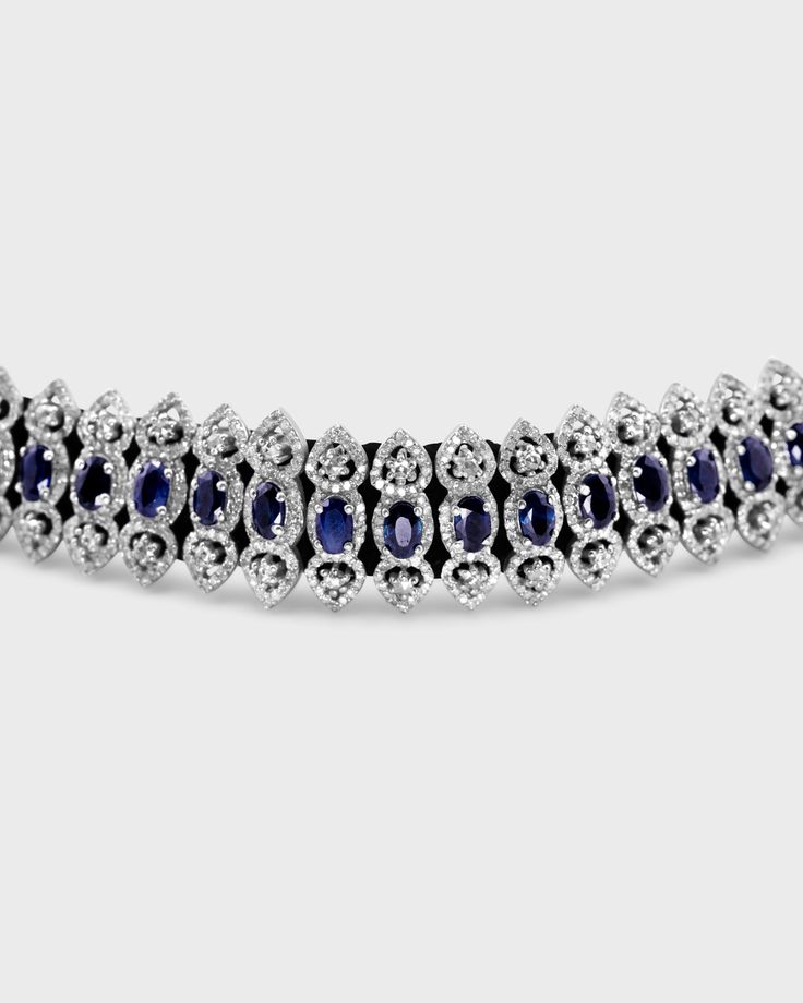 Oval-cut regal blue sapphires handset throughout with by sparkling diamonds creating a romantic bracelet perfect for any occasion. Handcrafted in the heart of New York City. Silver Diamond Blue Sapphire 14 to 16 inches Handmade in NYC Sapphire Jewelry With Single Cut Diamonds And Oval Shape, Formal Sapphire Jewelry With Single Cut Diamonds, Oval Sapphire Jewelry With Single Cut Diamonds, Blue Diamond Bracelet With Brilliant Cut Luxury Style, Luxury Blue Diamond Bracelet With Brilliant Cut, Luxury Blue Marquise Jewelry, Exquisite Blue Jewelry With Single Cut Diamonds, Blue Oval Diamond Bracelet With Jewels, Luxury Blue Oval Diamond Bracelet