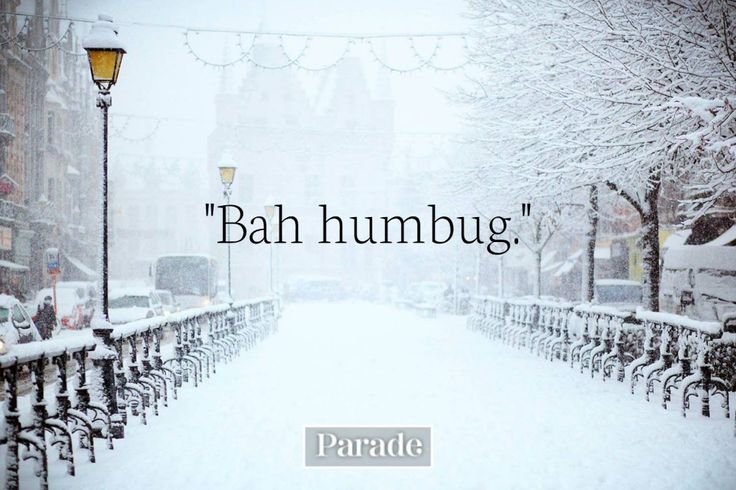 a snowy street with bikes parked on the side and a quote that reads,'bah humbug '