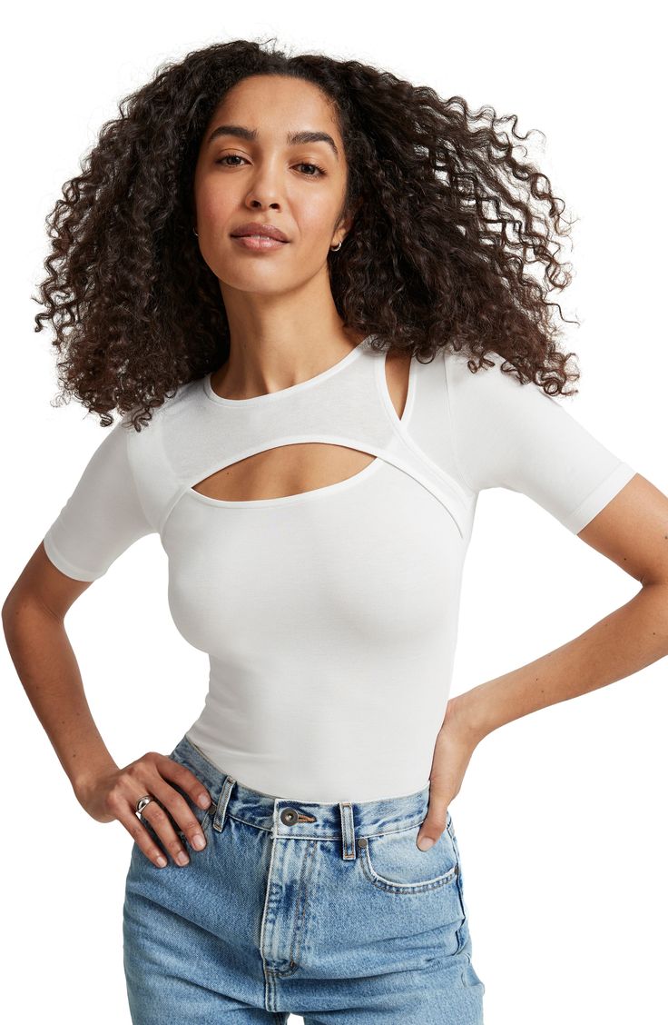 Fall for the layered look of this close-fitting top centered with an eye-catching front cutout. Crewneck Short sleeves 96% Tencel® lyocell, 4% elastane with 95% viscose, 5% elastane contrast Tencel lyocell is a more-sustainably produced fiber made with closed-loop processing Machine wash, line dry Imported Chic Cutout Tops In Elastane, Elastane Cutout Tops For Night Out, Cutout Tops For Night Out, Night Out Cutout Tops, Trendy Seamless Elastane Tops, Cropped Fitted Top Made Of Elastane, Modern Tops For Night Out, Layering Fitted Top In Elastane, Spring Crop Top In Elastane