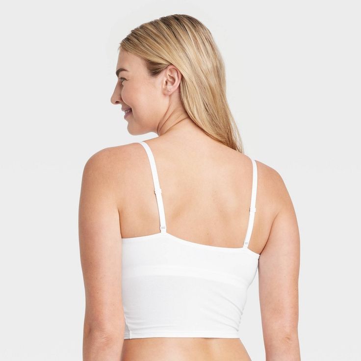 Give your everyday intimates a comfy upgrade with this Cotton Stretch Crop Cami Bralette from Auden™. This crop cami bralette is made of cotton jersey fabric with added spandex for a flexible fit that moves with you, while opaque lining provides extra coverage. The adjustable straps help you find the right fit, and unlined, wireless cups round out the design for support that maintains a natural, comfortable shape. Plus, removable padding provides a customized coverage. Auden™: Comfort true to ev Medium Support Camisole With Built-in Bra, Cotton Tops With Built-in Bra And Medium Support, Seamless Camisole Crop Top For Loungewear, Stretch Camisole Nursing Bra With Built-in Bra, Loungewear Bra With Spaghetti Straps, Seamless Cotton Sports Bra With Medium Support, Seamless Fabric Bra With Built-in Support, Casual Cotton Seamless Bra, Cotton Stretch Camisole With Bra-friendly Design