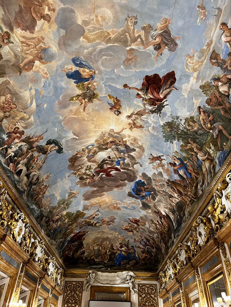 an ornate ceiling with paintings on it