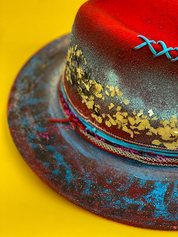 This original one-of-a-kind hat made by Aga Boho is in our Panama hat collection! Adjustable sizing, she's handpainted with custom trimmings. If you've always wanted a wearable piece of art that no one else has, this is the piece for you. Size: Hat Circumference : 23.5"(inch) Hat Height : 5.25"(inch) Brim Circumference : 38"(inch) Brim Diameter : 13.65"(inch) Shipping Shipping on this hat is free and limited only to the United States and excluding Alaska and Hawaii. If interested in internationa Unique Short Brim Top Hat For Festivals, Unique Festival Top Hat With Short Brim, Custom Hand Painted Fedora For Festivals, Handmade Artistic Fedora With Curved Brim, Custom Handmade Fedora, Hand Painted Fedora Hat Bands For Festivals, Unique Flat Brim Fedora For Festivals, Custom Hand Painted Hat Bands For Festivals, Festival Short Brim Hand Painted Hat