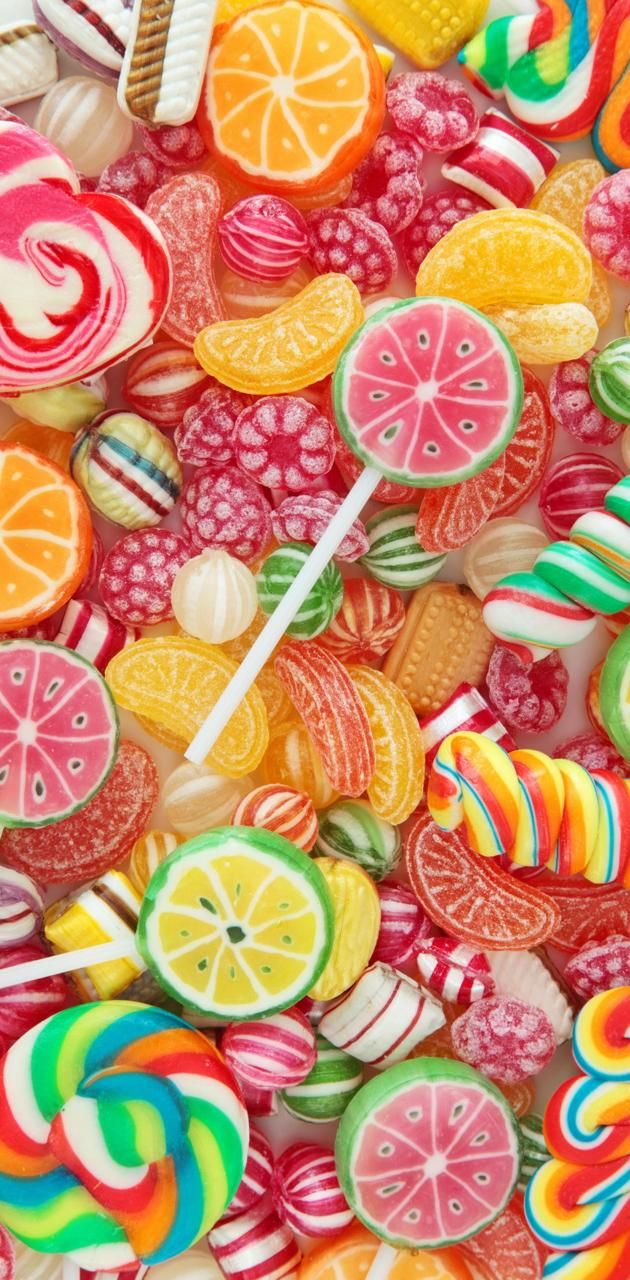 colorful candies and lollipops are arranged together