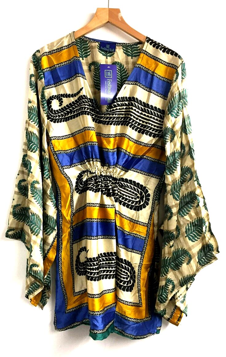 Boho hippy Festival sari silk KAFTAN tunic top blouse dress cover up ONE SIZEThis top will fit sizes UK 10 12 14 16 18This listing is for a stunning deep v-neck sari-silk tunic top, in a loose fit. This very feminine tunic is loose fitting and has a romantic look, the cut is flattering to the figure with smocking below the bust and across the back. Long length flutter sleeves in a retro kaftan style. The length of this top allows it to be worn as a short dress if you wish, and it is also ideal f Bohemian V-neck Kaftan For Spring, Printed V-neck Tunic, Traditional Green V-neck Tunic, Bohemian V-neck Printed Blouse, V-neck Dresses For Vacation Festivals, Silk V-neck Blouse For Summer, Flowy Printed V-neck Tunic, Summer Silk V-neck Blouse, Multicolor V-neck Dress For Navratri