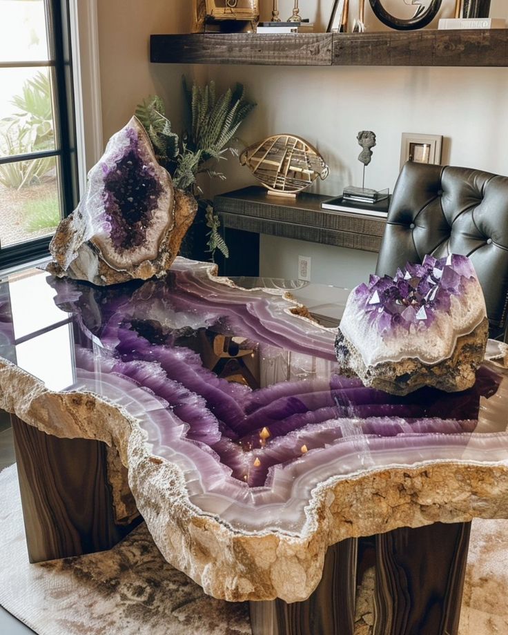 a table that has some kind of purple rock on it with other rocks around it